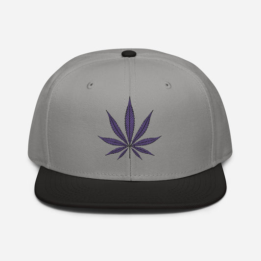 A gray and black Purple Haze Marijuana snapback baseball cap featuring a high-profile purple cannabis leaf design on the front.