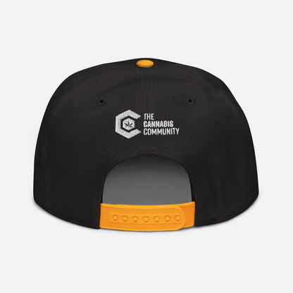 Golden Goat Cannabis Snapback Hat with "the cannabis community" logo embroidered on the front.
