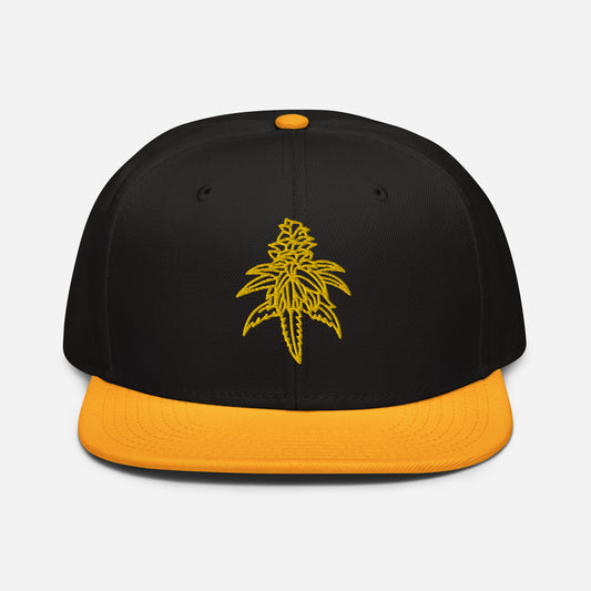 A black and yellow structured cap featuring an embroidered design of a yellow Golden Goat cannabis leaf on the front.