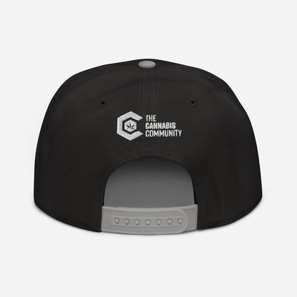 Rear view of a black Golden Goat Cannabis Snapback Hat with "the cannabis community" logo above the adjustable strap.