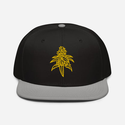 A structured Golden Goat Cannabis Snapback Hat with a yellow leaf embroidery on the front.
