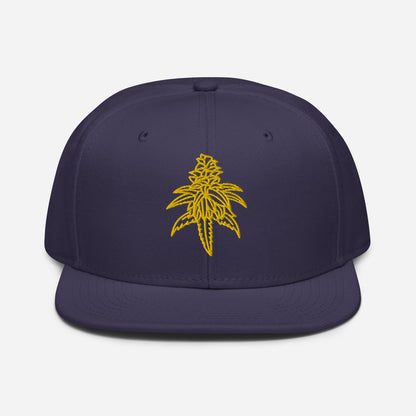 Golden Goat Cannabis Snapback Hat featuring a yellow embroidered design of a cannabis leaf on the front.