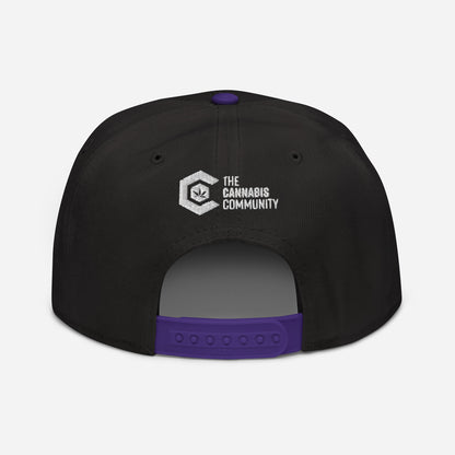 Golden Goat Cannabis snapback hat with "the cannabis community" logo embroidered on the front.