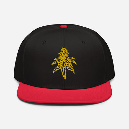 A black and red Golden Goat Cannabis snapback with a yellow leaf design embroidered on the front.