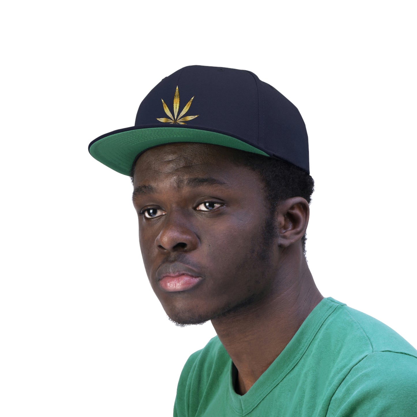 A young man in a green t shirt has on the navy blue Gold Marijuana Leaf Snapback Hat with green underbill