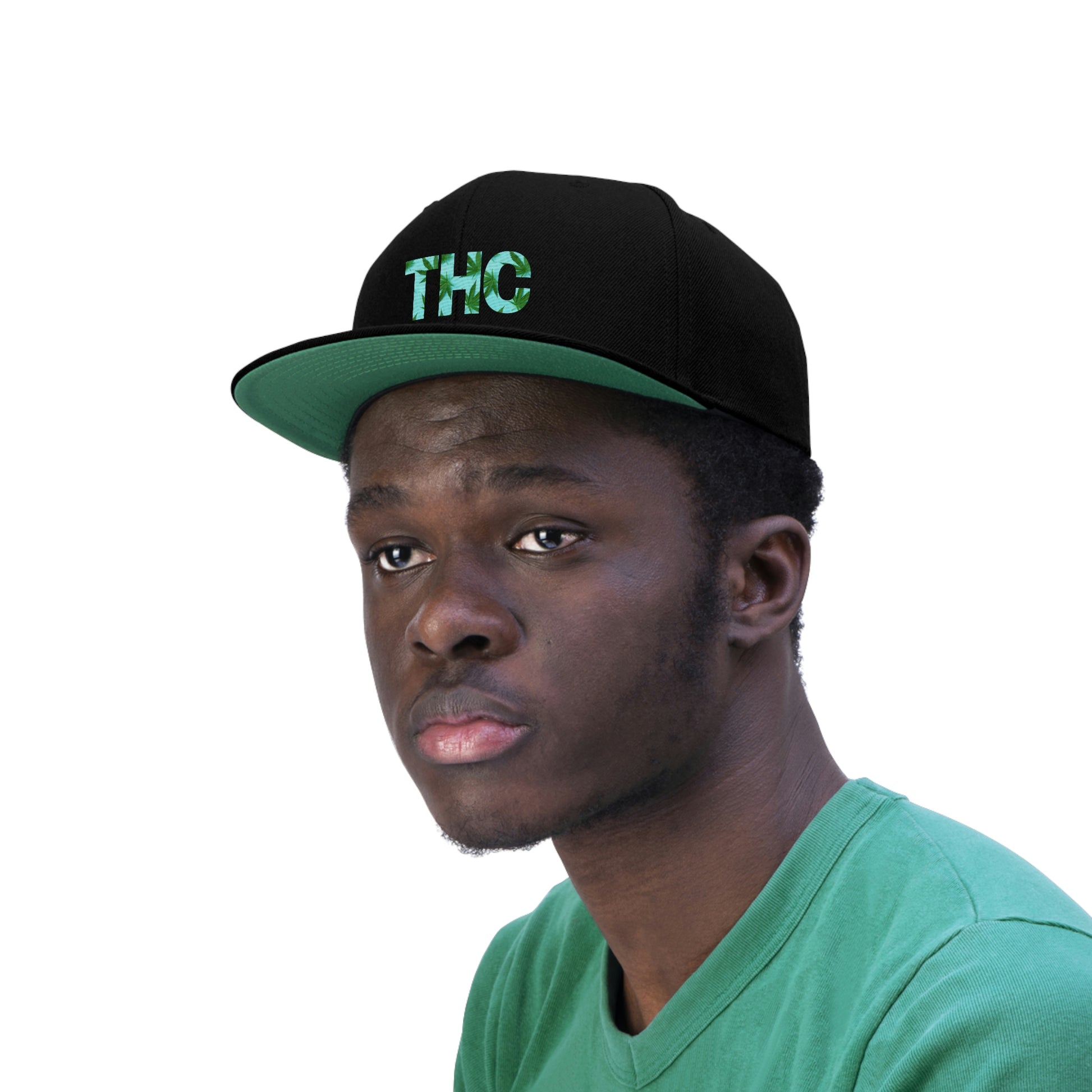A young man sports the all black THC Snapback hat that has cannabis leaves within the letters THC with a green underbill and soft green background