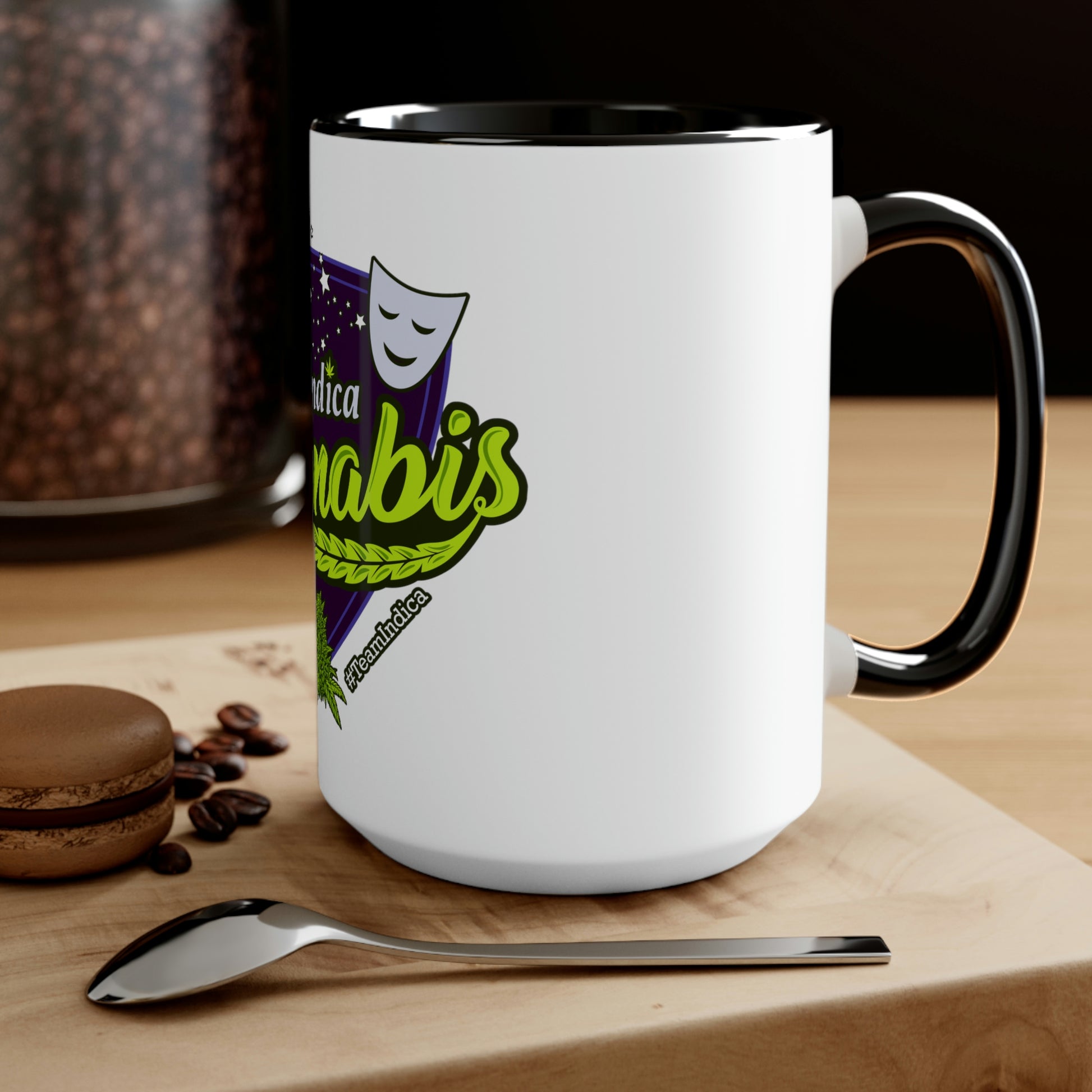 a Team Indica Cannabis Mug with coffee beans and a spoon on it.