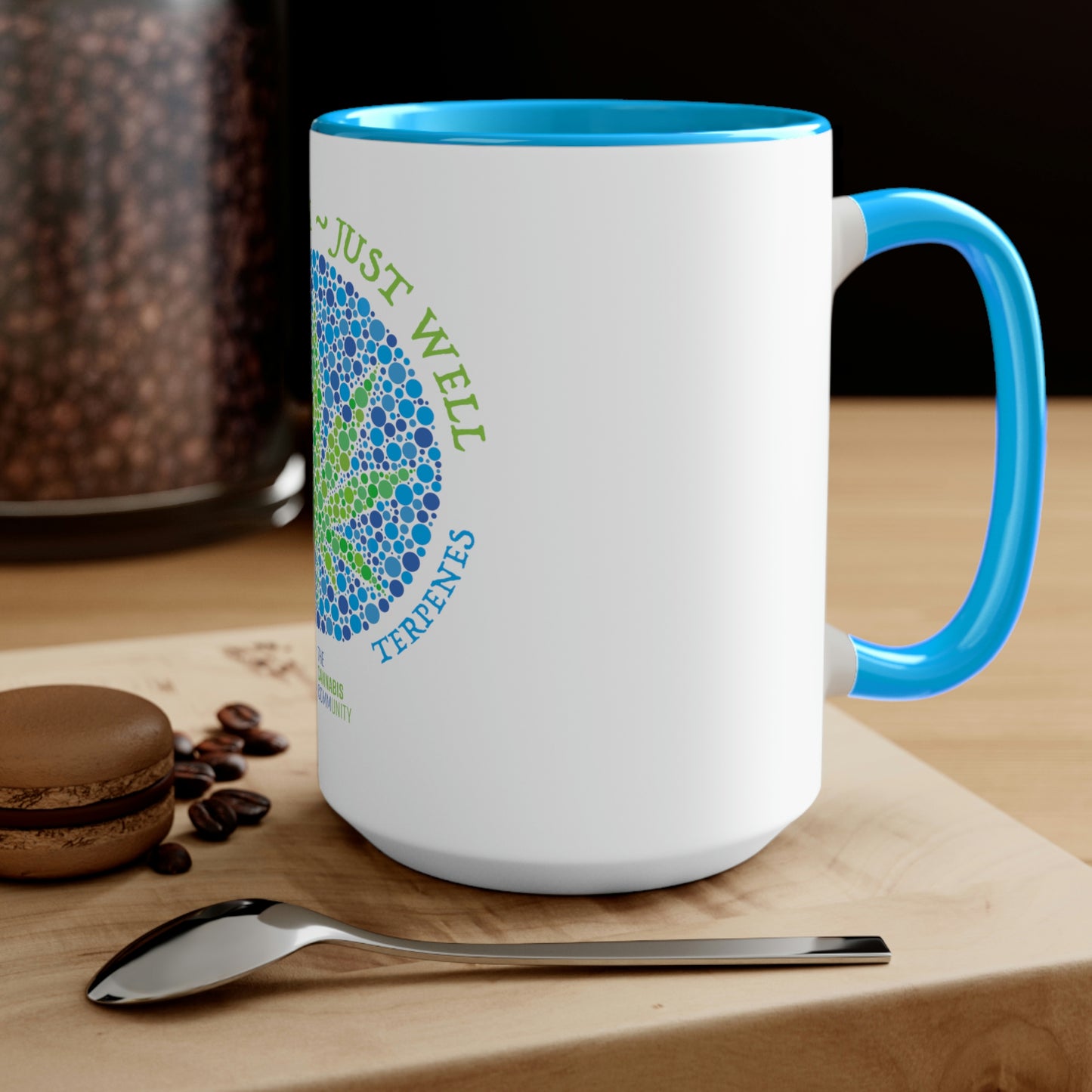 a Not High, Just Well Coffee Mug with a spoon and coffee beans on it.