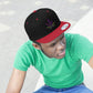 a young man in a green t shirt looks off to the side while wearing a black and red Purple Marijuana Leaf Snapback Hat