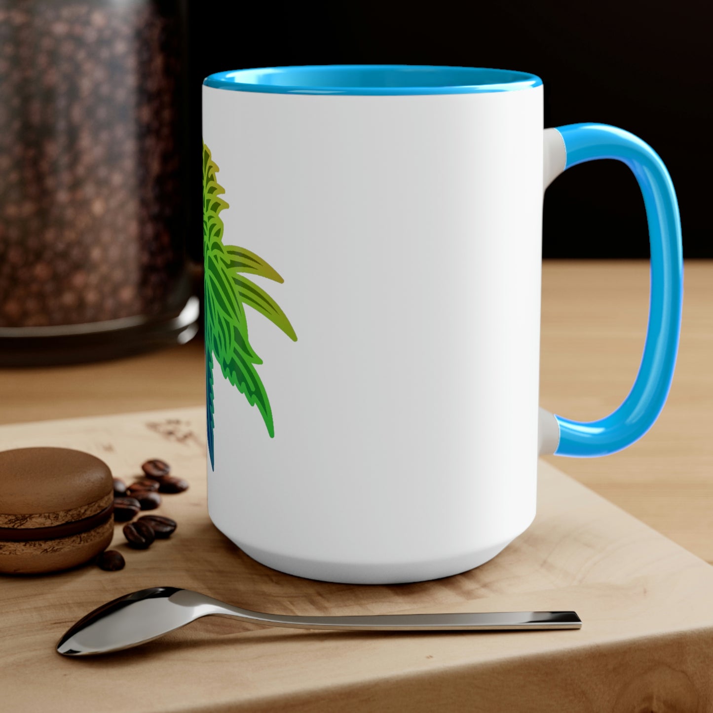 a Rainbow Sherbet Marijuana Tea Mug with a green plant on it.