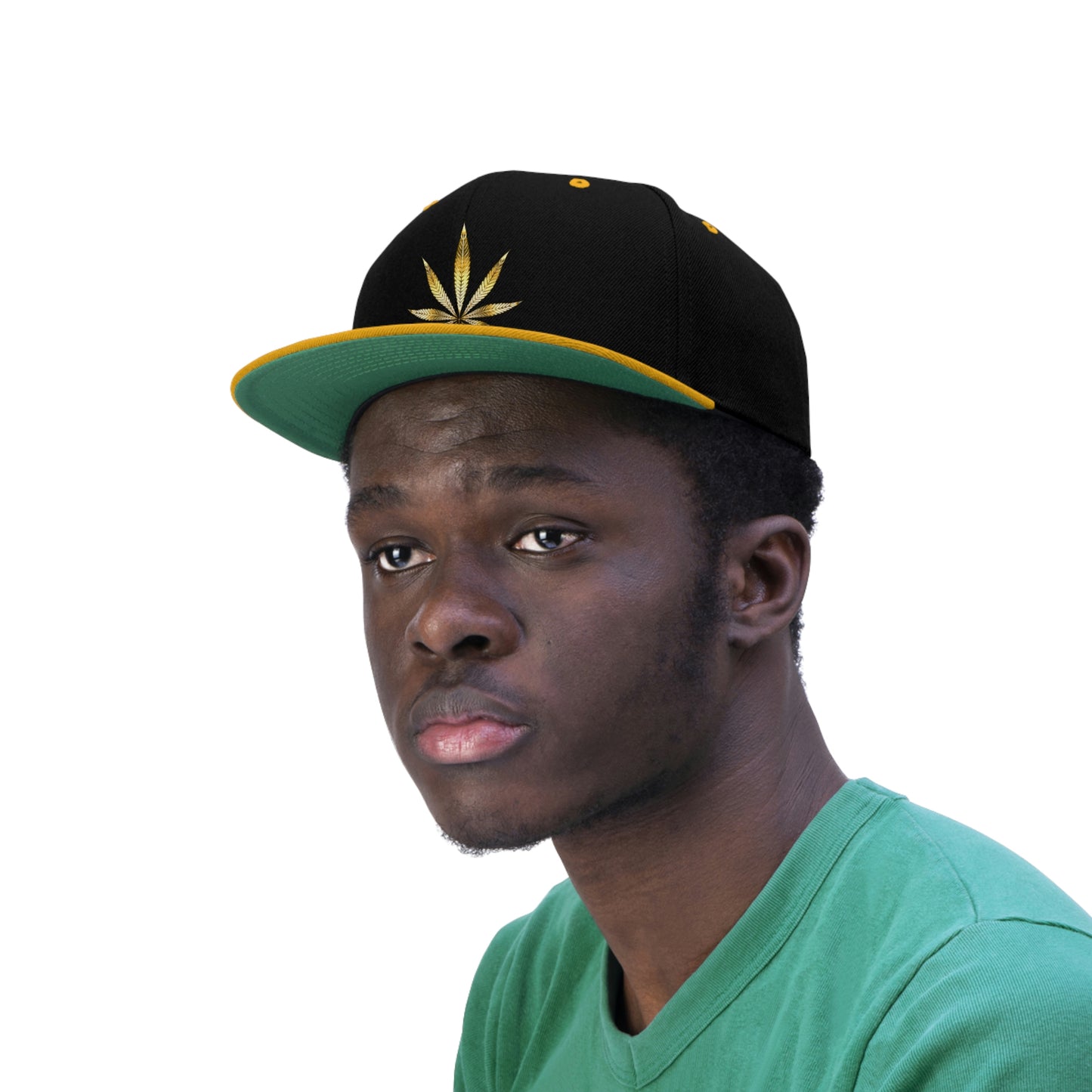 A young man looks out in the open while wearing the gold and black Gold Marijuana Leaf Snapback Hat with green underbill