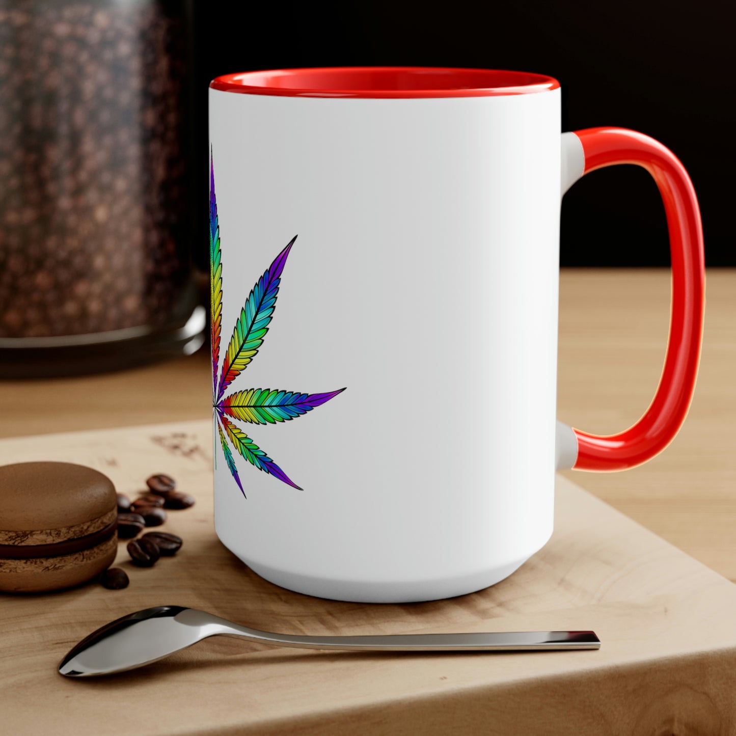a Vibrant Rainbow Cannabis Mug with a marijuana leaf on it.
