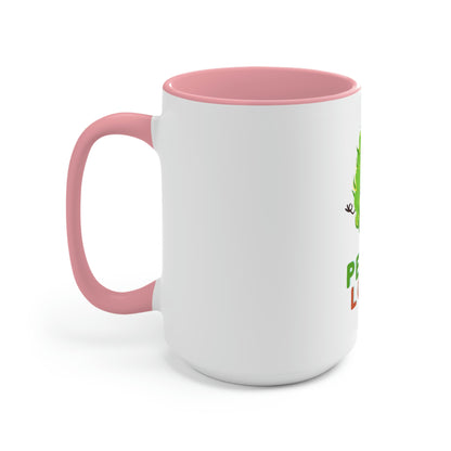 a Cannabis, Peace and Love coffee mug with a green lizard on it.