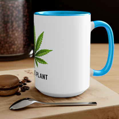 a Free the Plant Coffee Mug with a marijuana leaf on it.