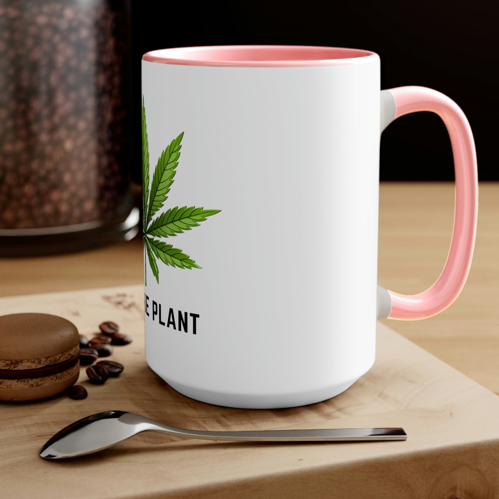 a Free the Plant Coffee Mug with a marijuana leaf on it.