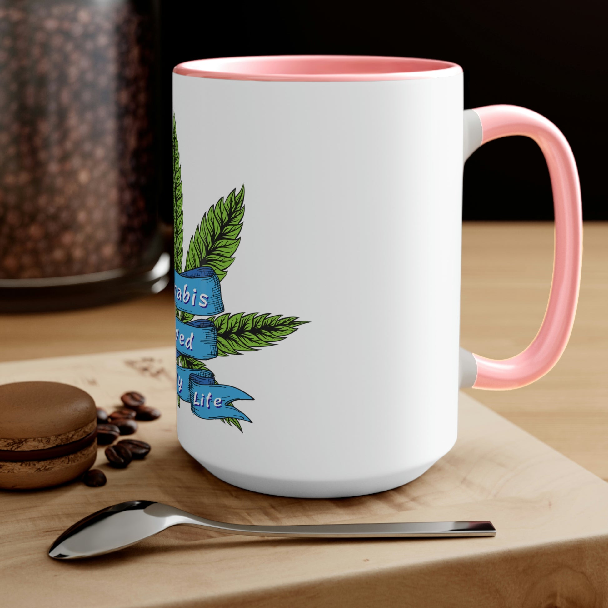 a Cannabis Saved My Life Mug with a marijuana leaf on it.