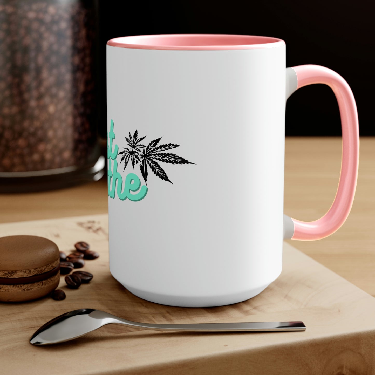 a Just Breathe Cannabis Tea Mug with marijuana leaves on it.