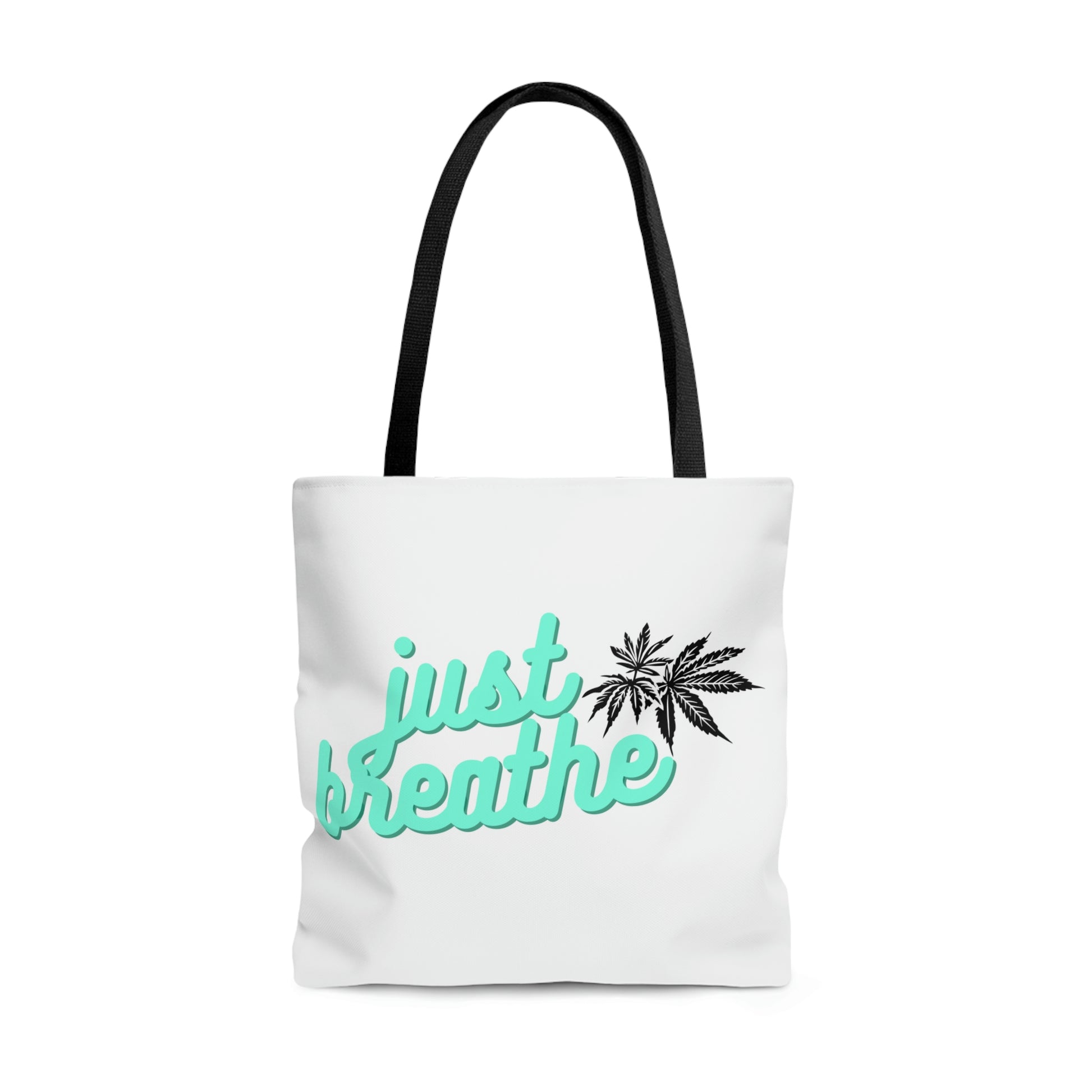 Just Breathe Cannabis Tote Bag with cursive lettering and cannabis leaves in the corner