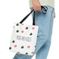 A man in jeans has the designer Nugs and Kisses Weed Tote Bag with great graphics depicting weed nuggets and kisses