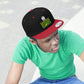 Photo of a young man staring while wearing the red and black Happiness Is Homegrown Weed Snapback Hat with picture of a white house above the lettering