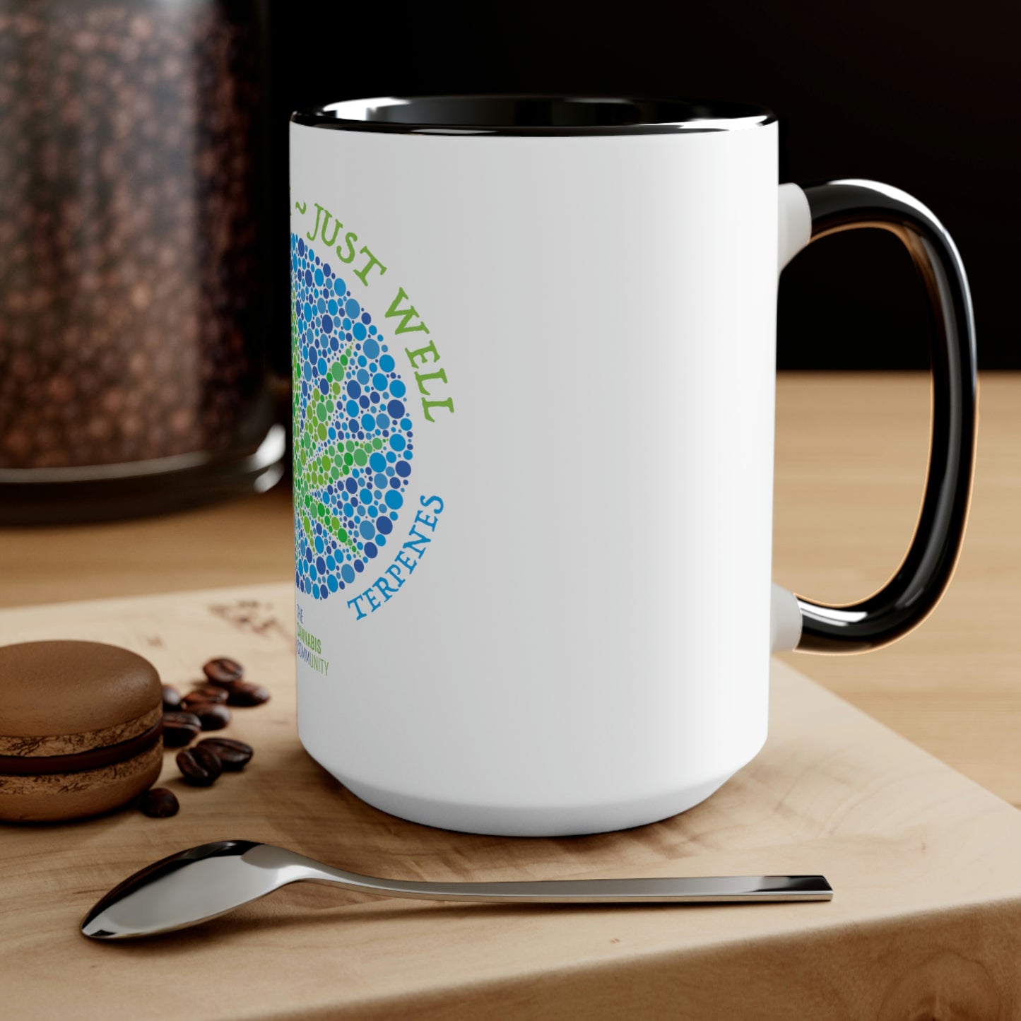 a Not High, Just Well Coffee Mug with coffee beans and a spoon next to it.