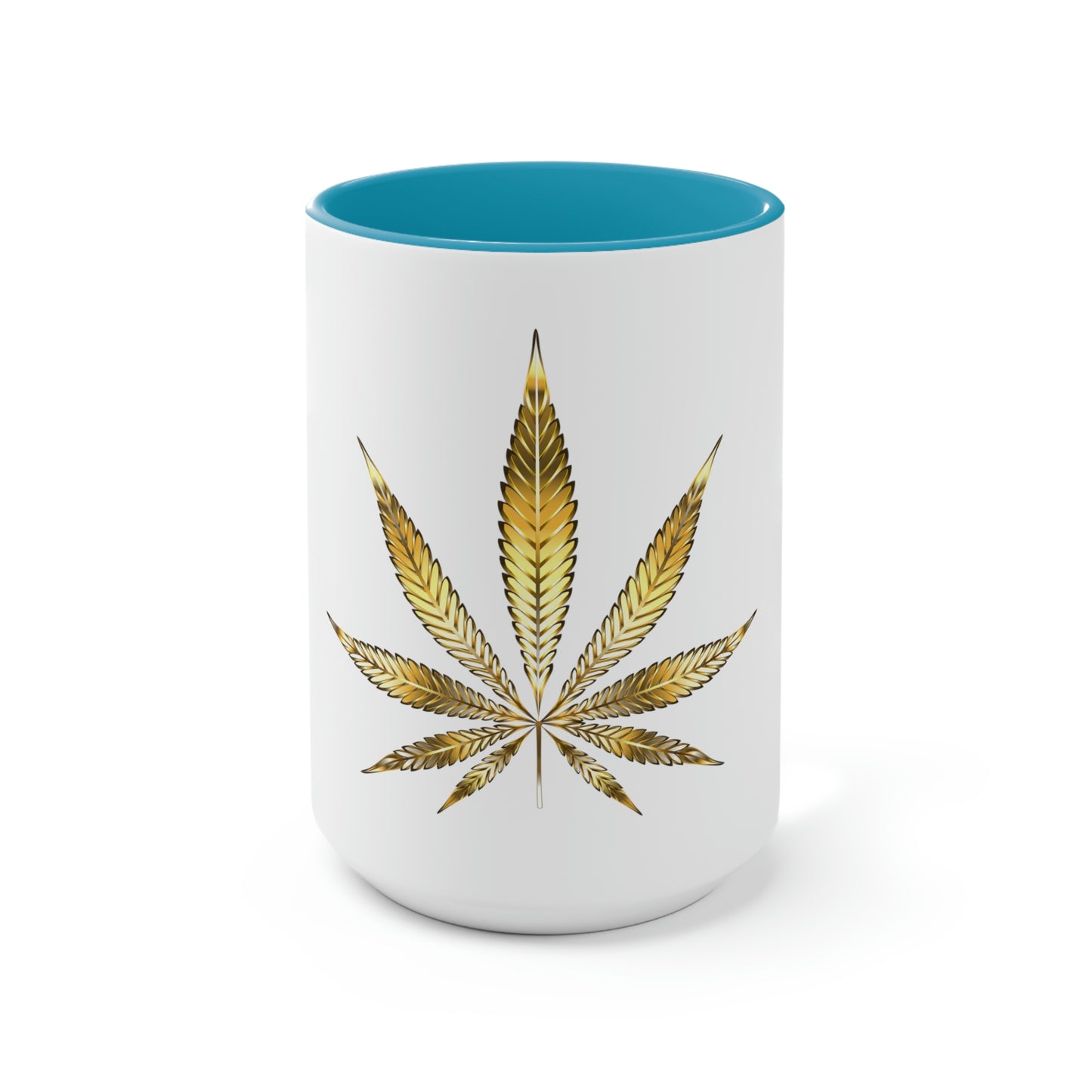 A white cannabis mug with a light blue interior featuring a bright gold weed leaf on the front center.