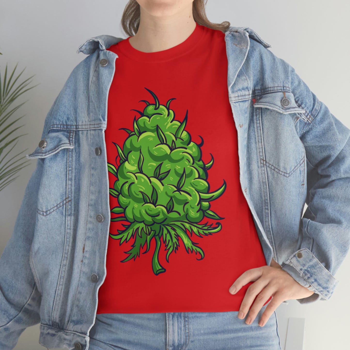 a woman wearing a Big Cannabis Bud Heavy Cotton Tee and jeans.