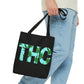 A man is holding the THC Black Weed-Themed Tote Bag as he walks onward