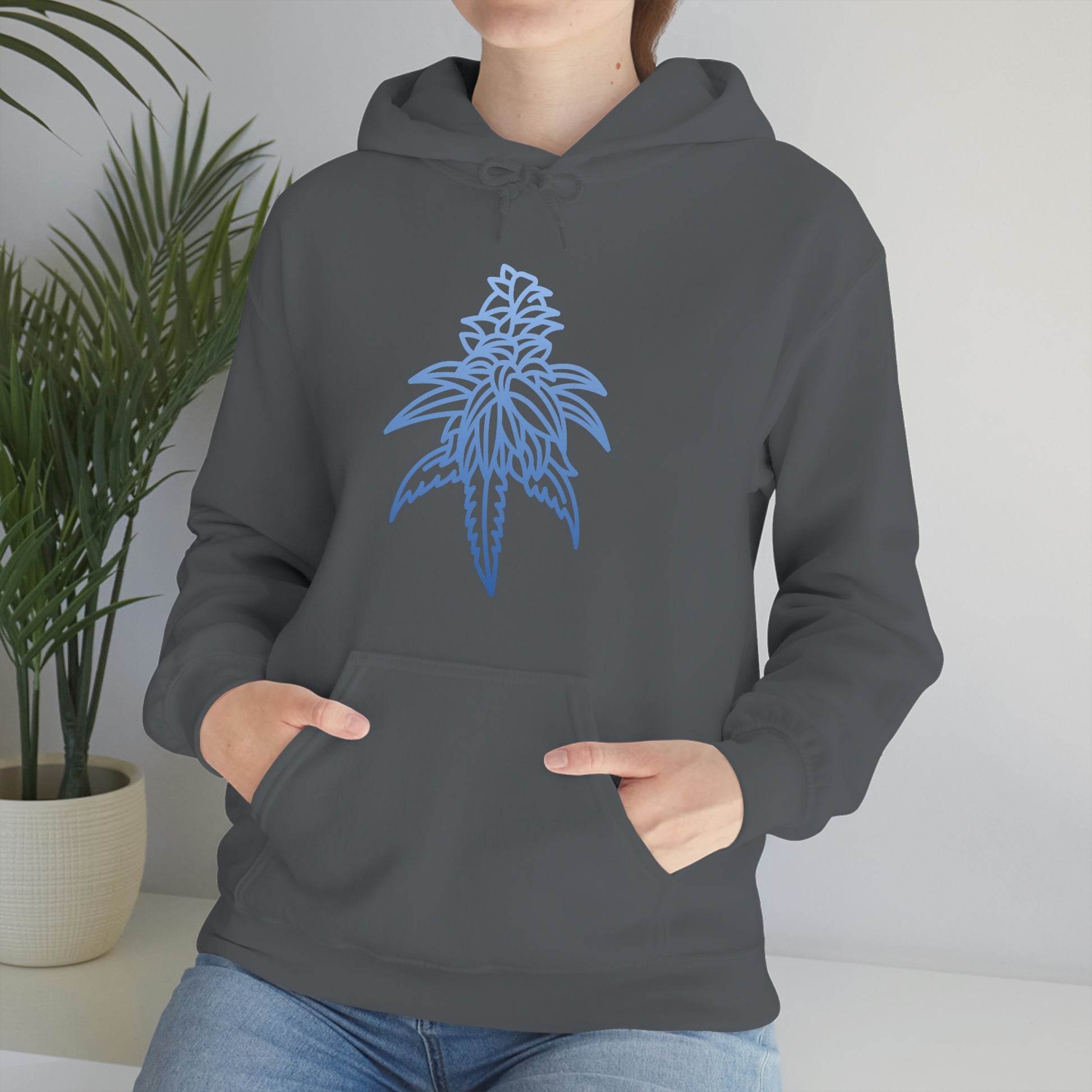 a woman wearing a gray Blue Dream Cannabis Hoodie with a blue leaf on it.