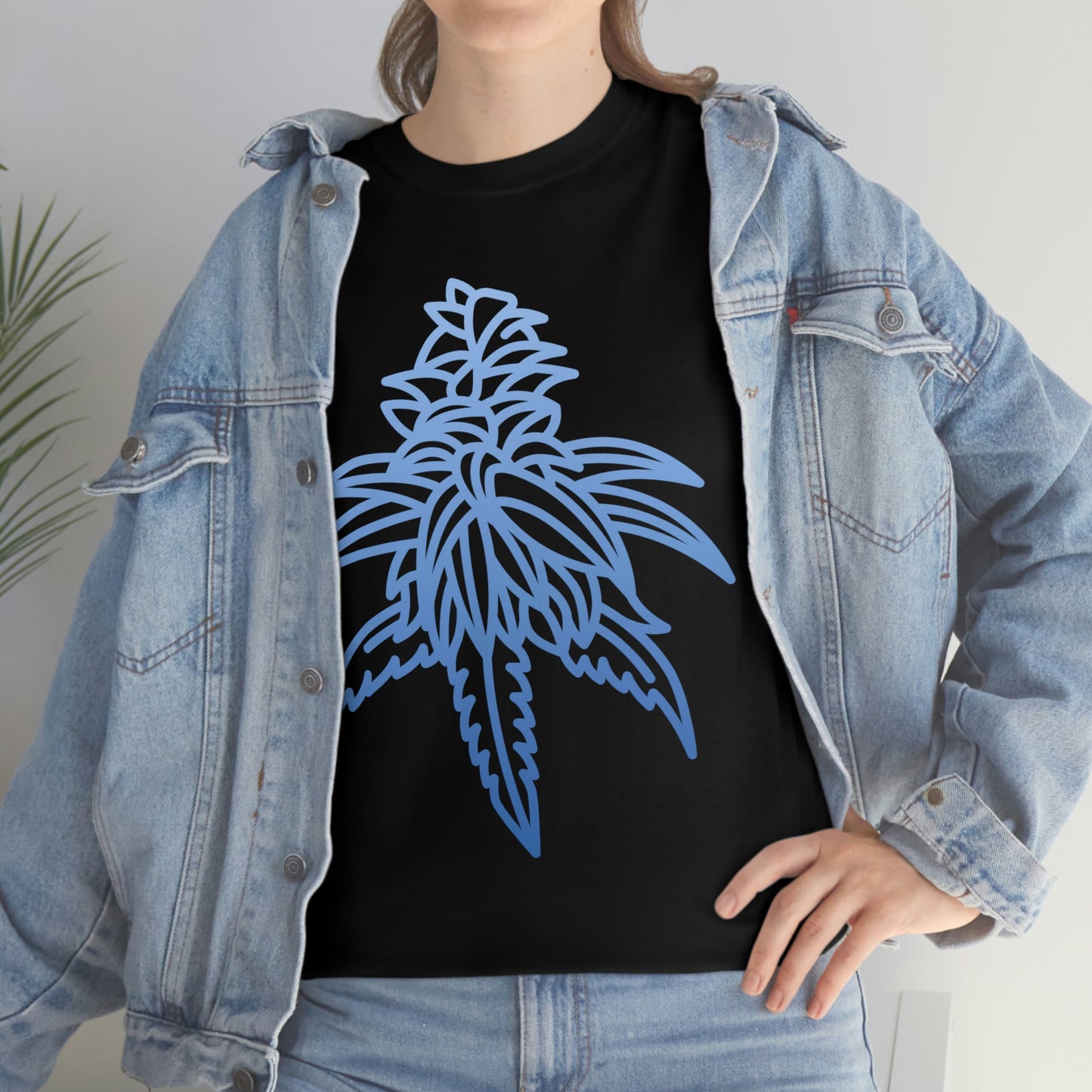 a woman wearing a Blue Dream Cannabis Tee with blue leaves on it.