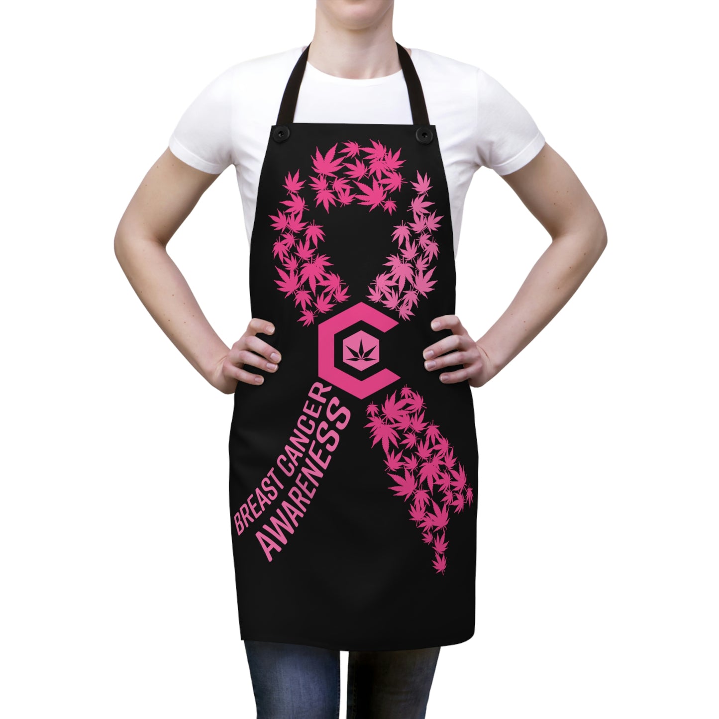 Woman wearing the pink and black Breast Cancer Awareness Chef's Apron with  pink weed leaves