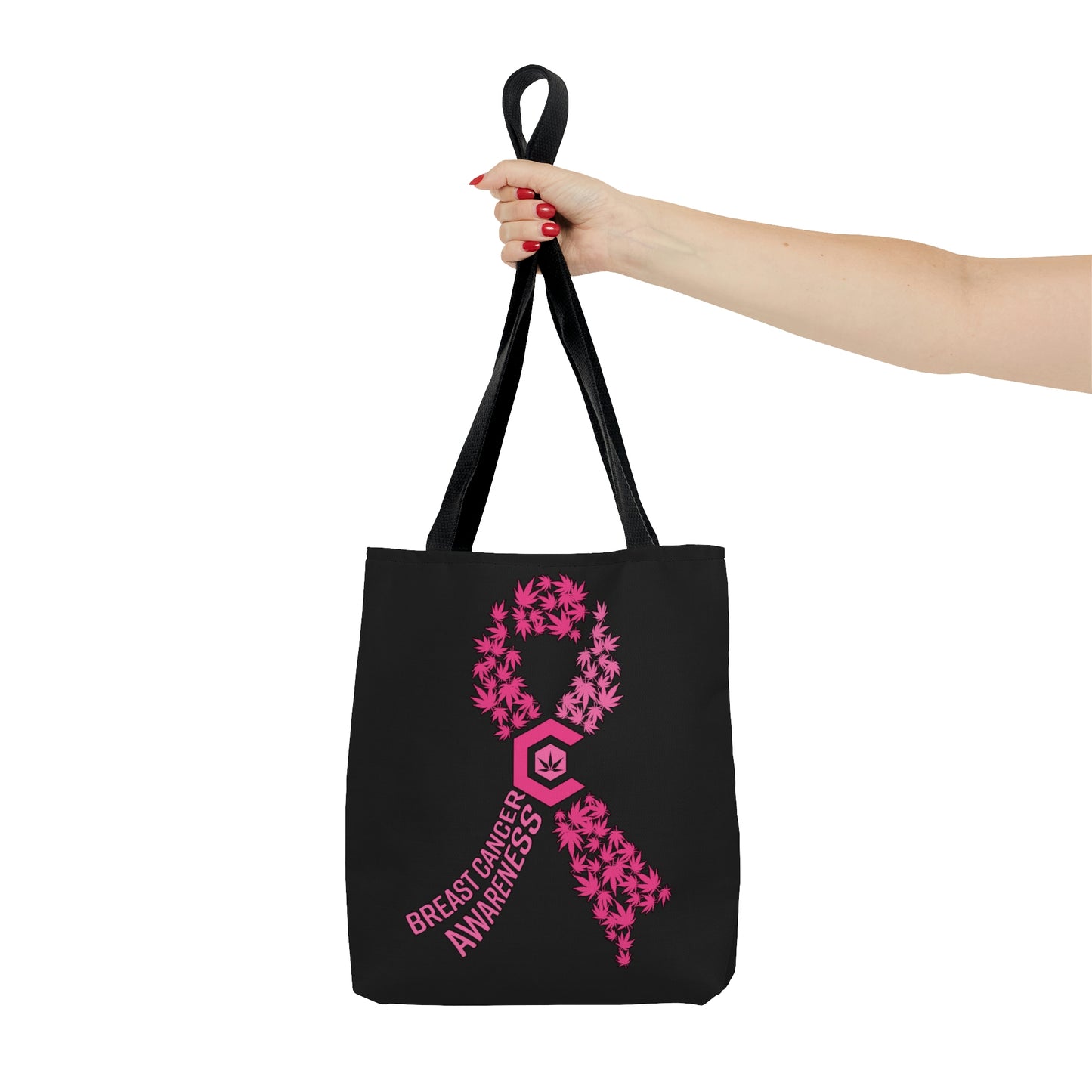 A woman with outstretched hand renders the Breast Cancer Awareness Black Tote Bag with pink weed graphics and words out in front of her