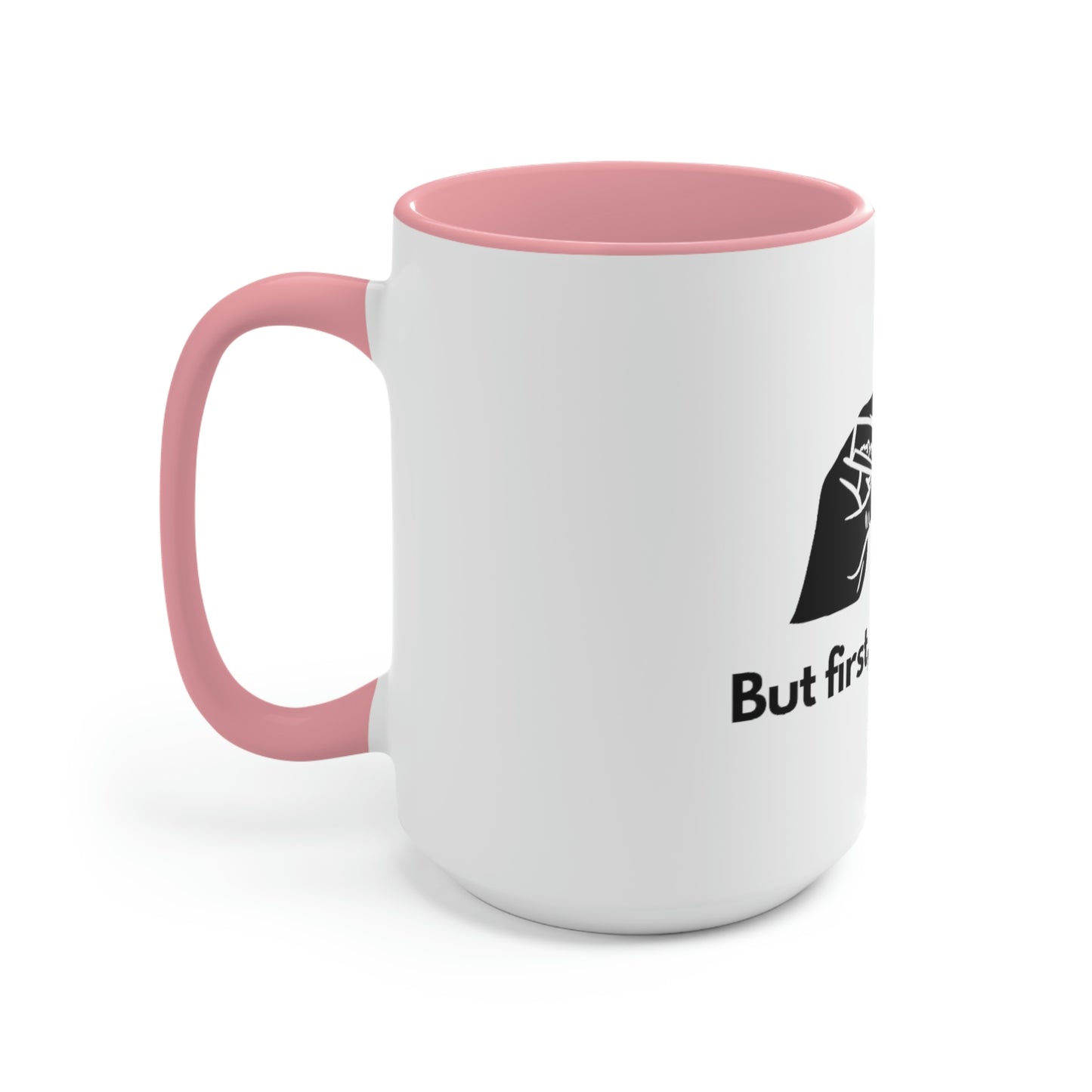 The left side of a pink and white ceramic mug that reads "but first, let's smoke" with a hand silhouette holding a weed joint.