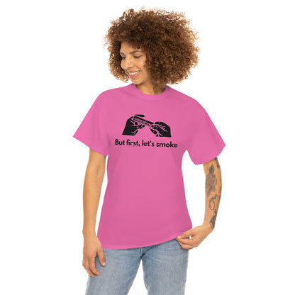 a woman wearing a pink But First, Let's Smoke Tee that says be the change you want to see.