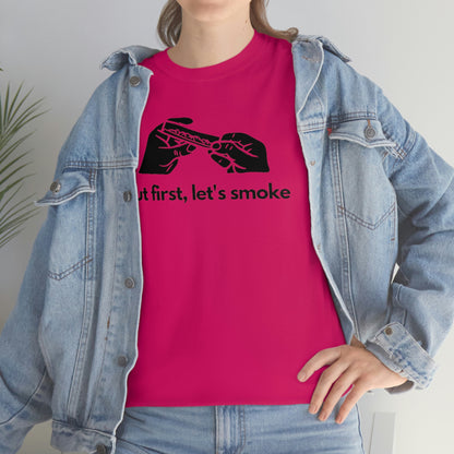 a woman wearing a pink "But First, Let's Smoke Tee" t-shirt.