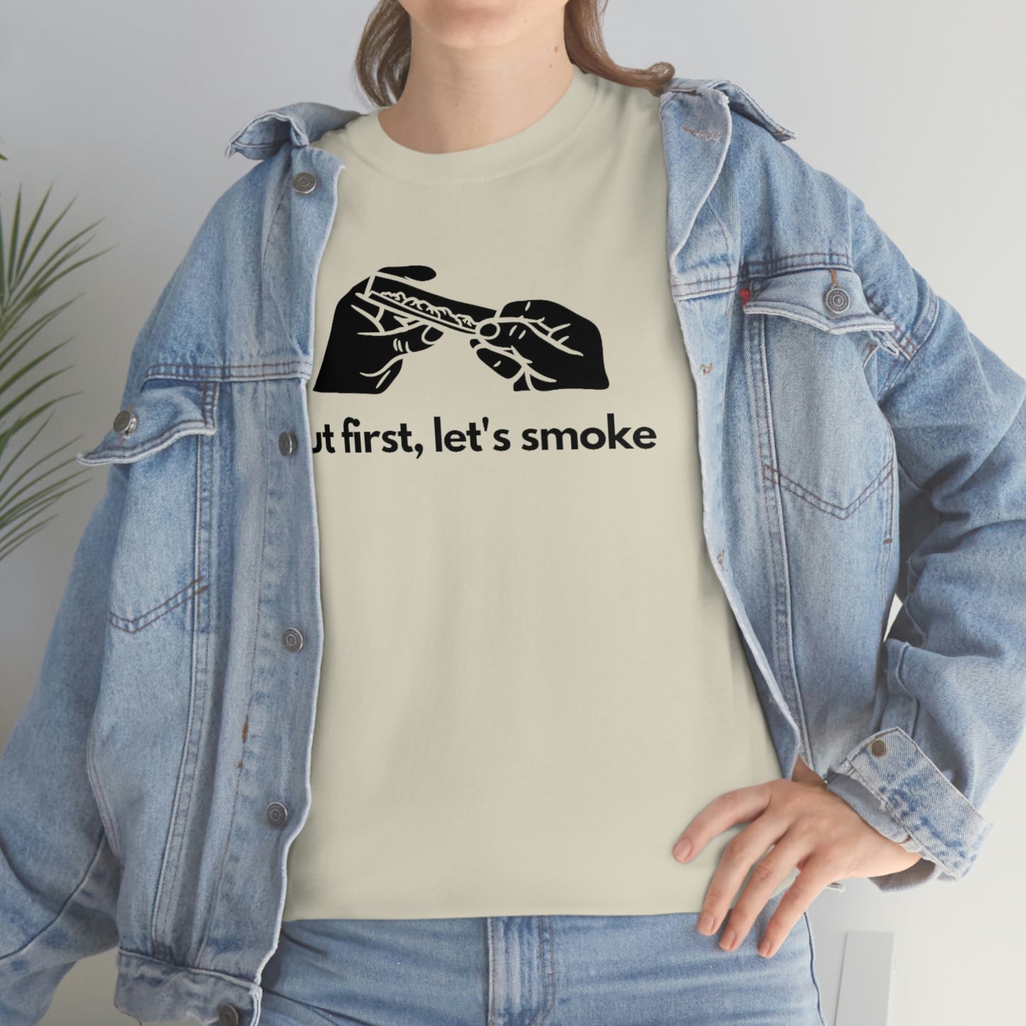 a woman wearing a But First, Let's Smoke Tee.