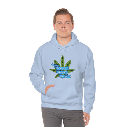 A young man wearing a light blue colored Cannabis Saved My Life hoodie.