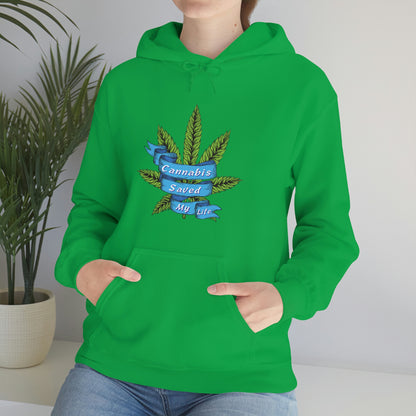 A woman wearing a green Cannabis Saved My Life Cannabis Hoodie with a marijuana leaf on it.