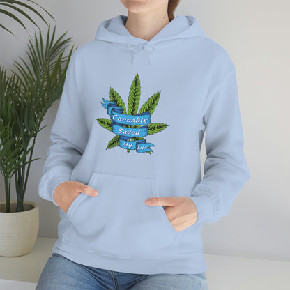 a woman wearing a blue Cannabis Saved My Life Cannabis Hoodie with a marijuana leaf on it.