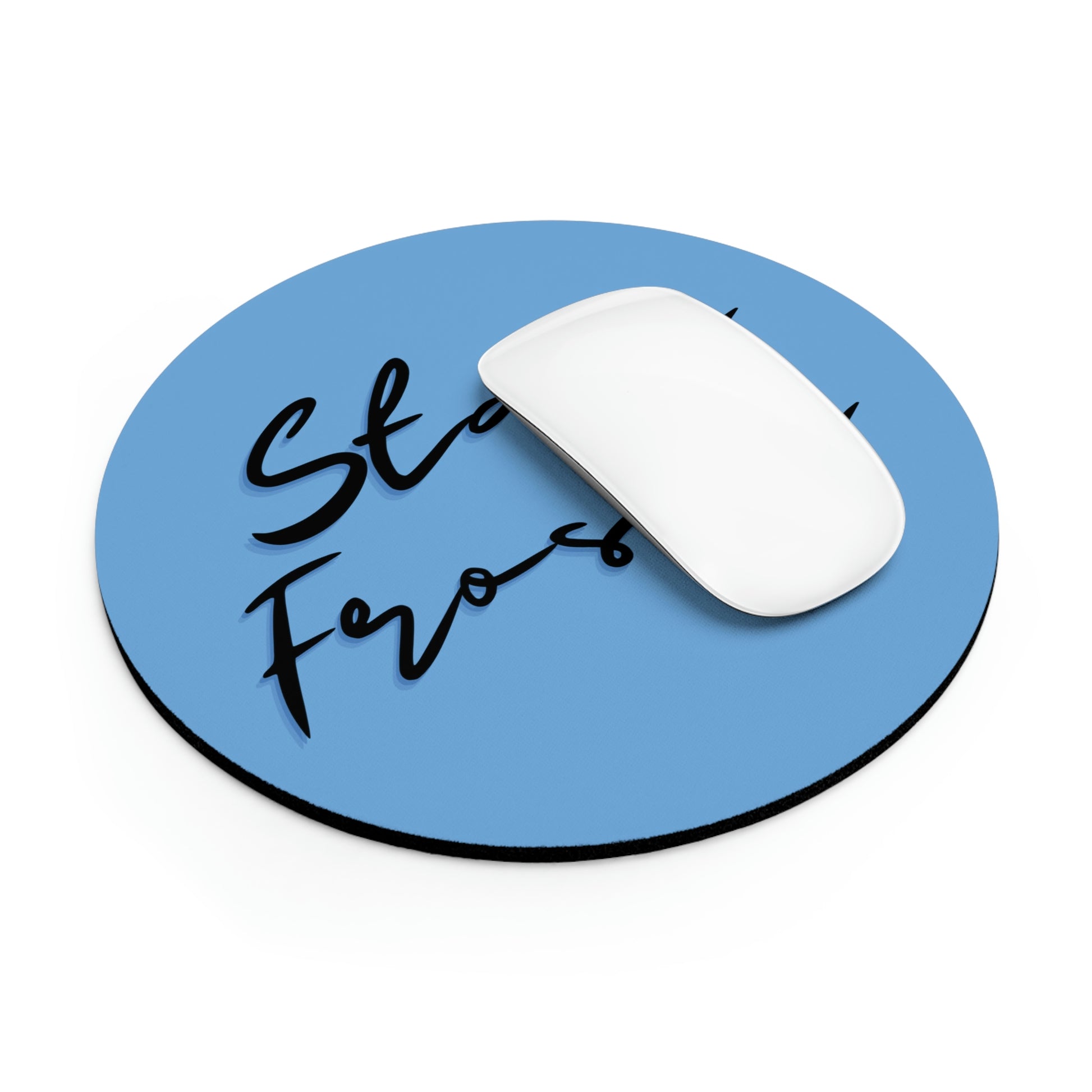 A white computer mouse on a Stay Frosty Blue Mouse Pad with the phrase "stay focused" written in black cursive.