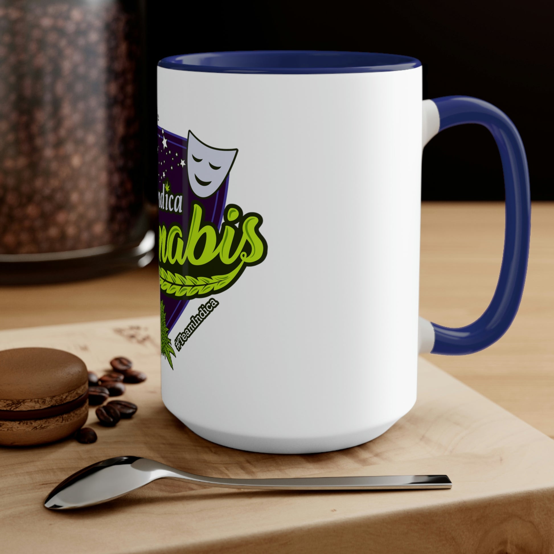 a Team Indica Cannabis Mug with a spoon and coffee beans on it.