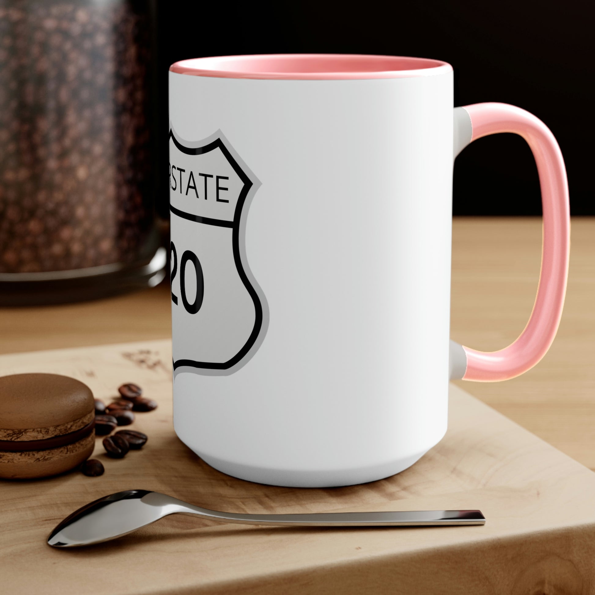 Interstate 420 Two-Tone pink and white Coffee Mug on top of a wooden table