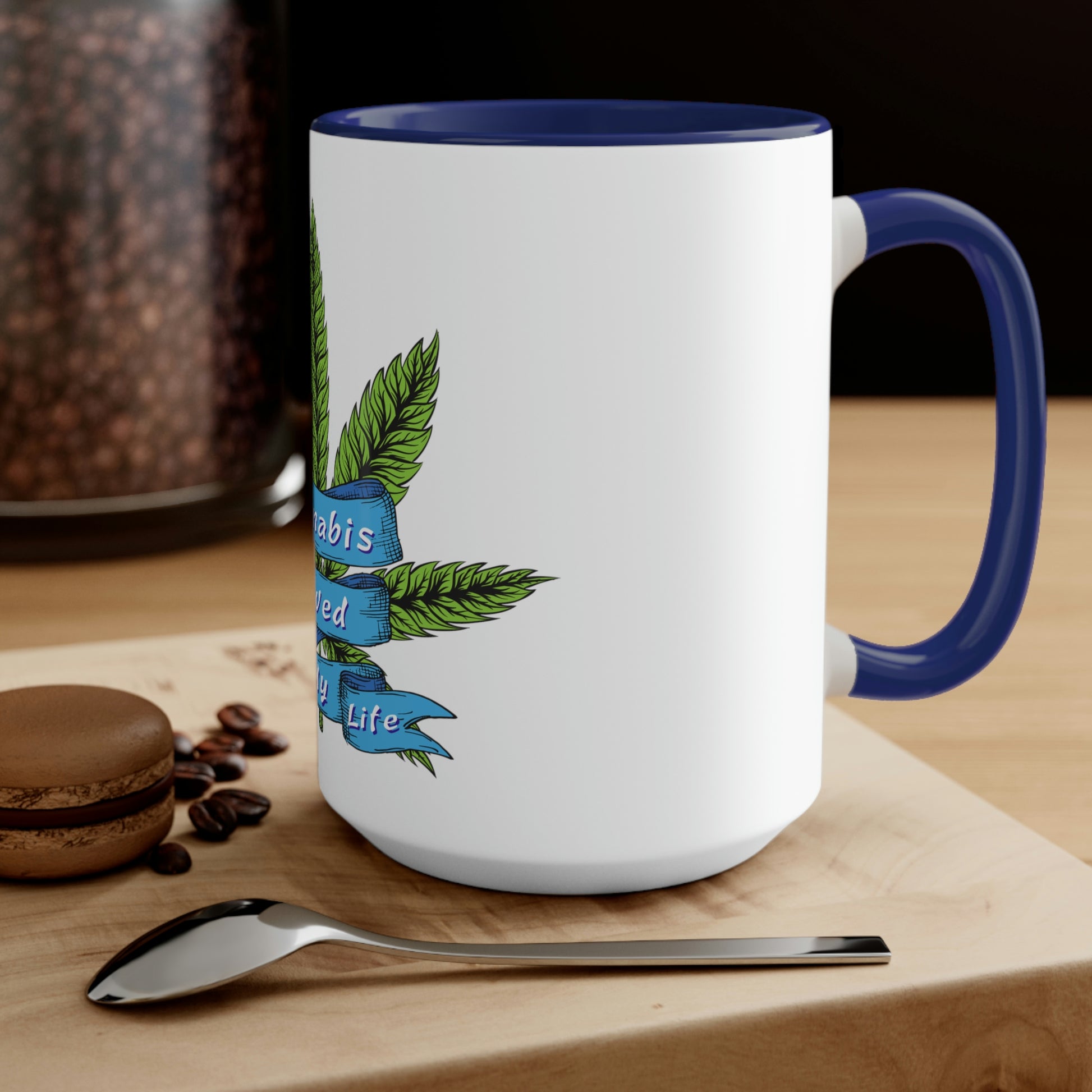 a Cannabis Saved My Life Mug with a marijuana leaf on it.