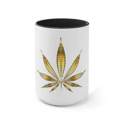 A white cannabis mug with a black interior featuring a bright gold weed leaf on the front center.