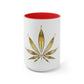 A white cannabis mug with a red interior featuring a bright gold weed leaf on the front center.