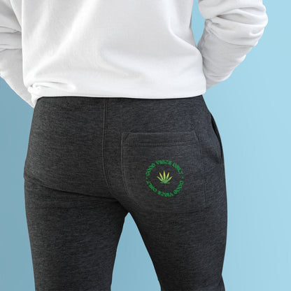 the back of a man wearing Good Vibes Premium Fleece Joggers with a marijuana leaf on it.