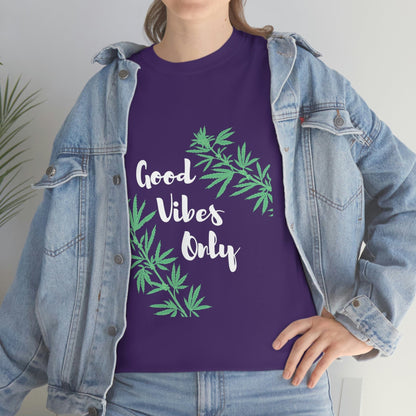 A person is sporting a denim jacket over the Good Vibes Only Leaf T-Shirt, which features cannabis leaf designs, exuding a laid-back style.