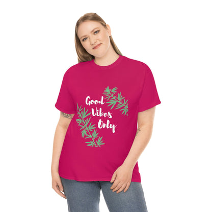 A person is wearing the Good Vibes Only Leaf T-Shirt, featuring stylized cannabis leaf designs, against a plain white background.