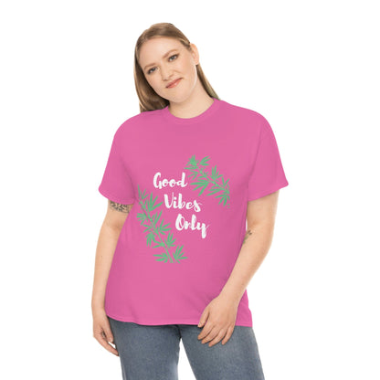 A person wearing the Good Vibes Only Leaf T-Shirt, which features a green cannabis leaf design and the text "Good Vibes Only," is standing against a white background.