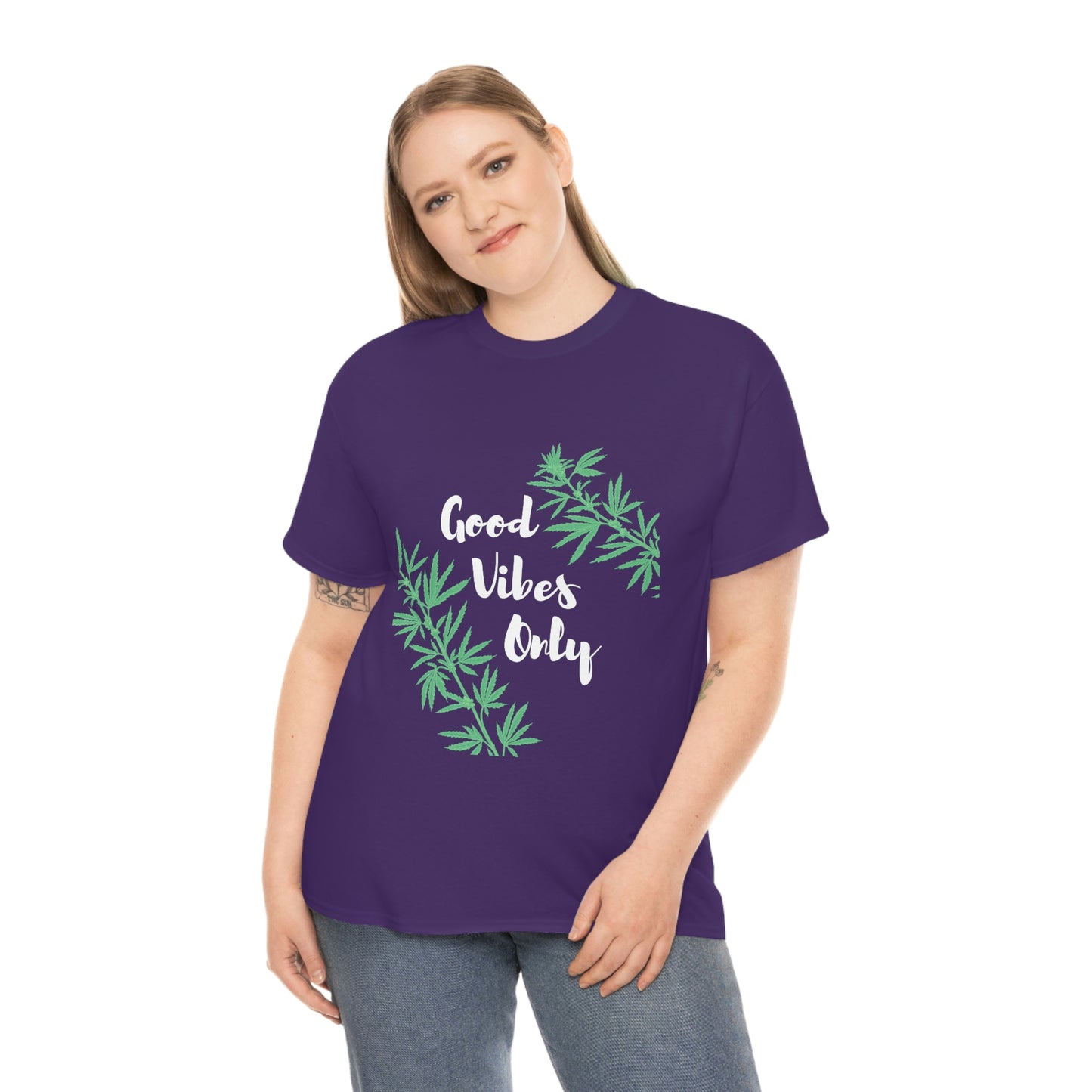 a woman wearing a purple good vibes weed shirt